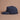 Navy_blue_cap_with_Let_s_Pickle_logo_on_a_brown_background 1